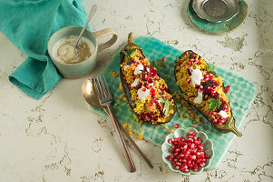 Aubergine stuffed with couscous and pomegranate seeds