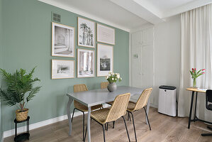 Dining area with picture gallery in two-room flat, Warsaw