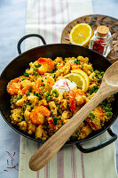 Low carb cauliflower paella with prawns and peas