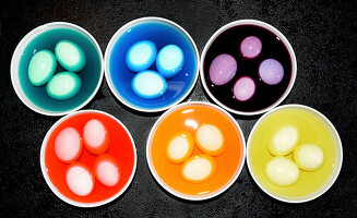 Dyeing different coloured Easter eggs