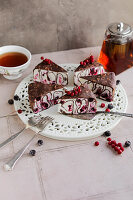 Ice cream cake with chocolate pancakes and redcurrants