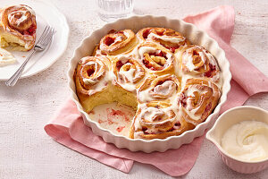 Sweet strawberry rolls with icing