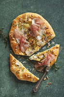 Potato galette with prosciutto, parmesan and pine nuts