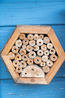 Insect hotel in the wall of a house, close-up