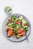 Colourful quinoa salad with smoked salmon and dressing