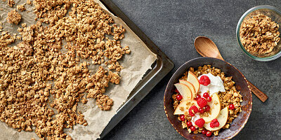 Homemade granola with yoghurt, apples and berries