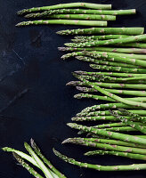 Green asparagus on a black background