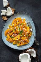 Orange salad with grated coconut and mint