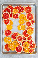 Dried orange slices and grapefruit slices on a tray