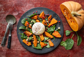 Warm salad with pumpkin, burrata and nuts