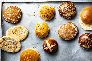 Different types of buns on a baking tray