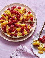 Pudding and cream cake with raspberries and peaches without baking