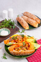 Asian hot dog with satay chicken, carrots and mango