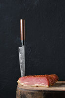 Dried leg of pork on a wooden board