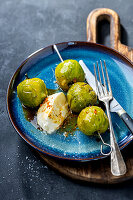 Green tomatoes on skewers with mozzarella and balsamic vinaigrette