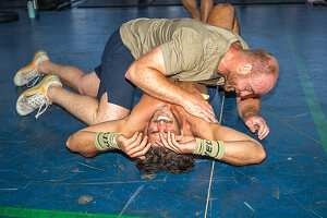 Two athletes engaging in a physically demanding CrossFit competition in Sevilla, Spain. Display of strength, endurance, and determination.