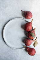 Red Batler pears on a ceramic plate