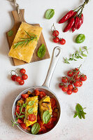 Courgette omelette with tomato and aubergine vegetables