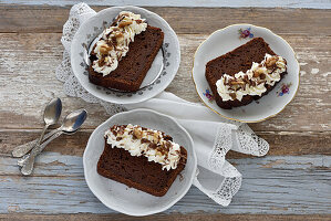 Vegan sweet potato brownie cake with whipped cream and walnuts