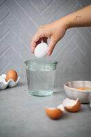 Shelf life test - checking eggs in a glass of water