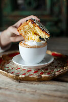 Pastry with cappuccino in the background