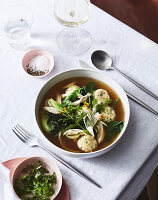 Chicken soup with sourdough dumplings and fresh herbs