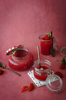 Freshly cooked strawberry jam in jars