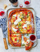 Pizza tray with three types of cheese and pickled chilli peppers