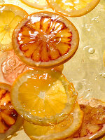 Lemon and blood orange slices in water