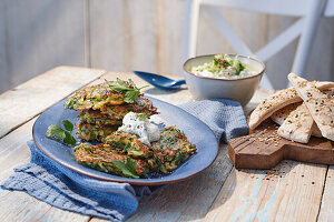 Courgette fritters with cucumber and garlic dip