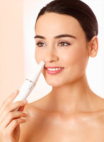 Young woman doing facial treatment