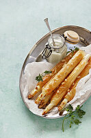 Asparagus in filo pastry with pine nuts and dip