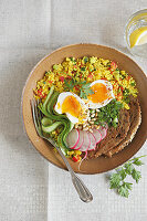 Couscous bowl with vegetables, egg and toasted bread