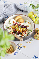 Burrata with balsamic grapes, thyme and pine nuts