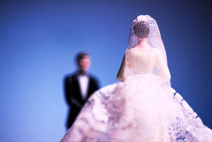 Close up of bride and groom figurines.