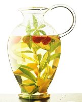 Jug of fruit macerated with herbs