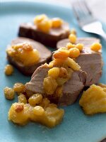 Pork filet mignon with pineapple chutney, raisins and ginger