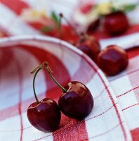 Fresh cherries on checked napkin