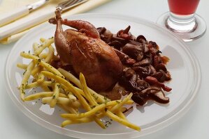 Quail with butter beans and mushrooms