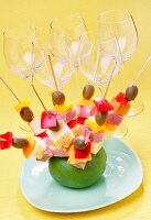 Party skewers with olives, cheese, salami and red peppers