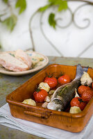 Bass with cherry tomatoes and artichokes