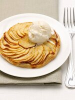 Flaky pastry apple tart and a scoop of ice cream