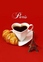 Composition with a mini Eiffel Tower,a heart-shaped cup of coffee and a mini croissant