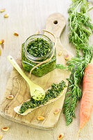 Small jar of carrot top pesto