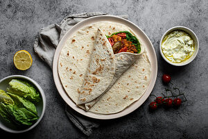 Chicken,tomato sauce and lettuce wrap
