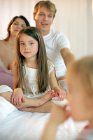 Young family in bedroom