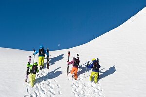 Skiers going uphill in the fresh snow, South Tyrol, Italy, Europe