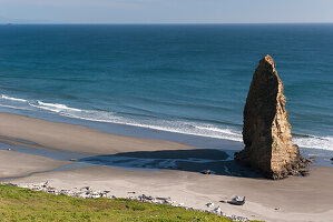 Sea stack rock formation on beach at Cape Blanco State Park, Oregon, USA