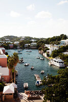 BERMUDA. Hamilton. View of Hamilton houses and boat dock from the Hamilton Princess & Beach Club Hotel.