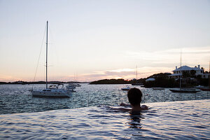 BERMUDA. The Infinity Pool at the Hamilton Princess & Beach Club Hotel. The Hamilton Harbour can be seen in the background.